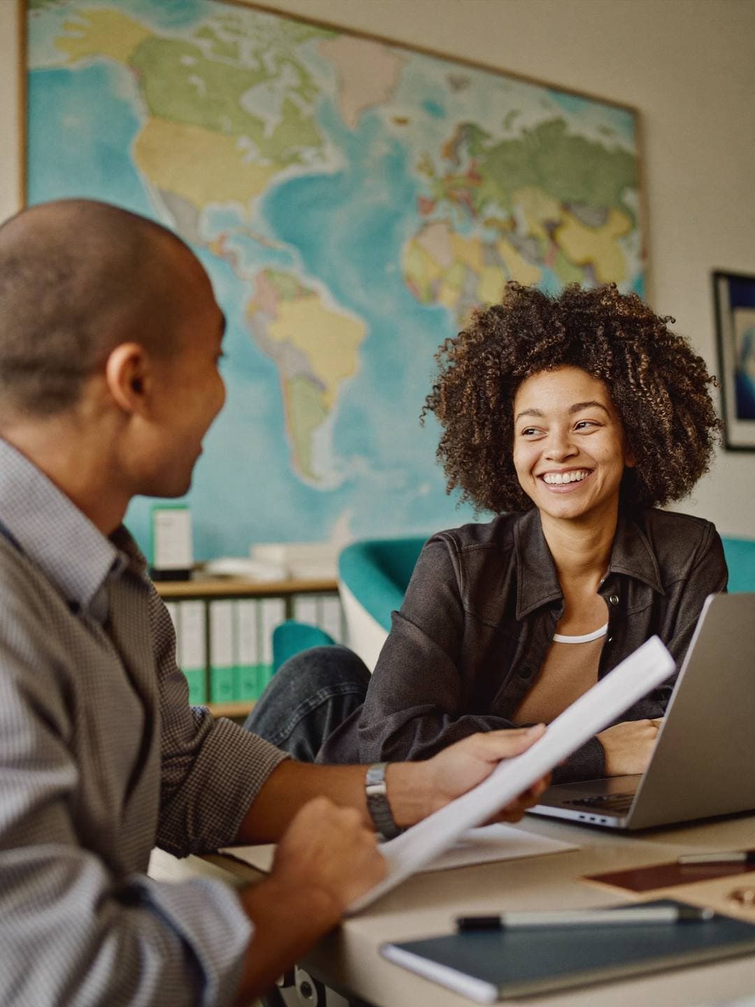 Travel agency accountant reviewing agency commission and booking records