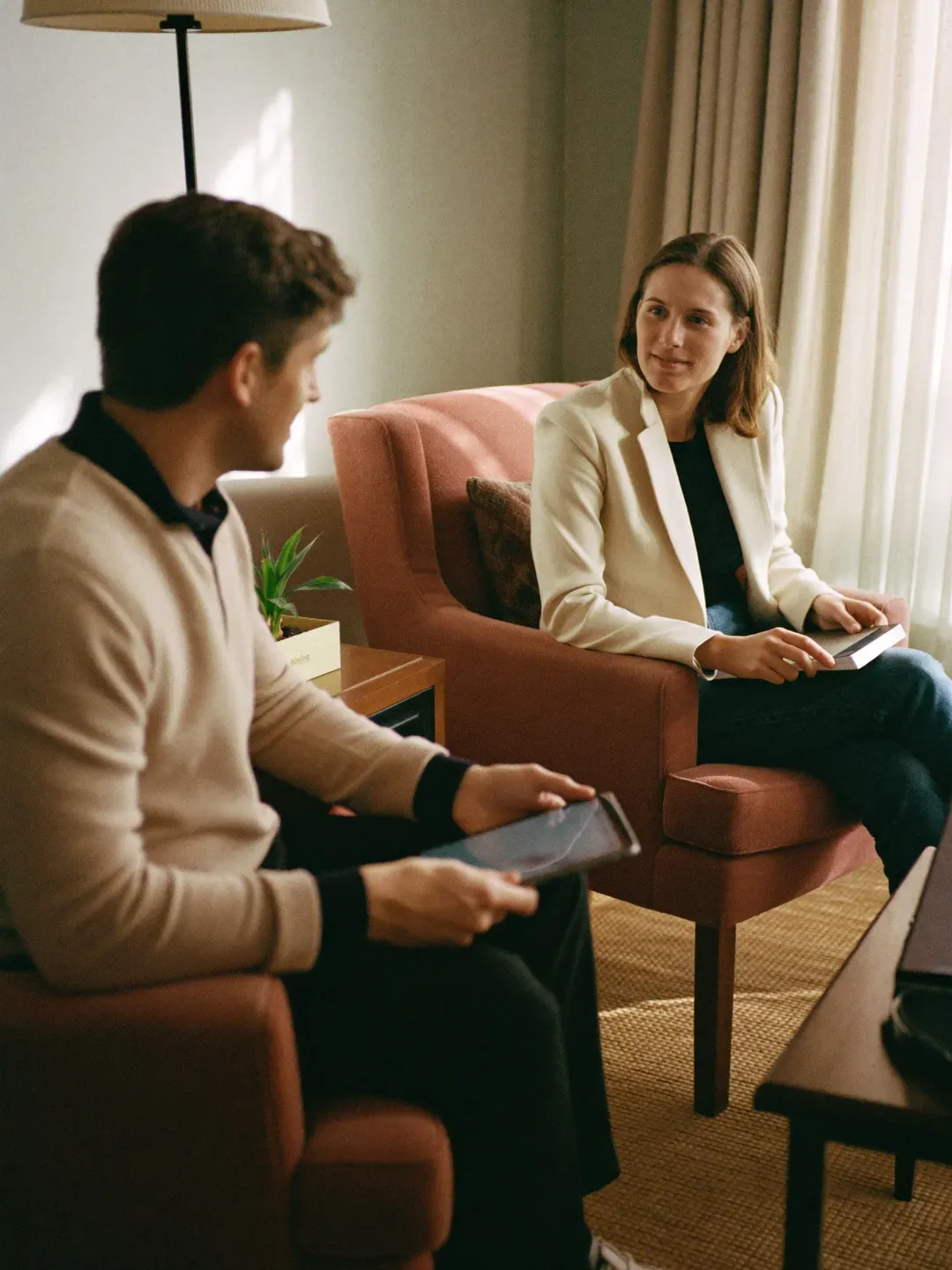 Accountant for therapists and social workers meeting a psychotherapist in a therapy room
